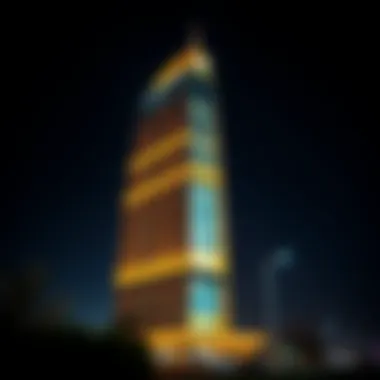 Illuminated Al Otaiba Building at Night Nighttime illumination of the Al Otaiba Building emphasizing its prominence