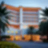 Exterior view of a luxurious hotel in Qusais, showcasing modern architecture