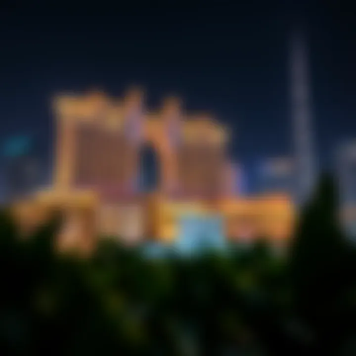 Night view of Royal Atlantis illuminated against the Dubai skyline